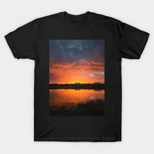 dramatic sunset sky reflecting on pond T-Shirt